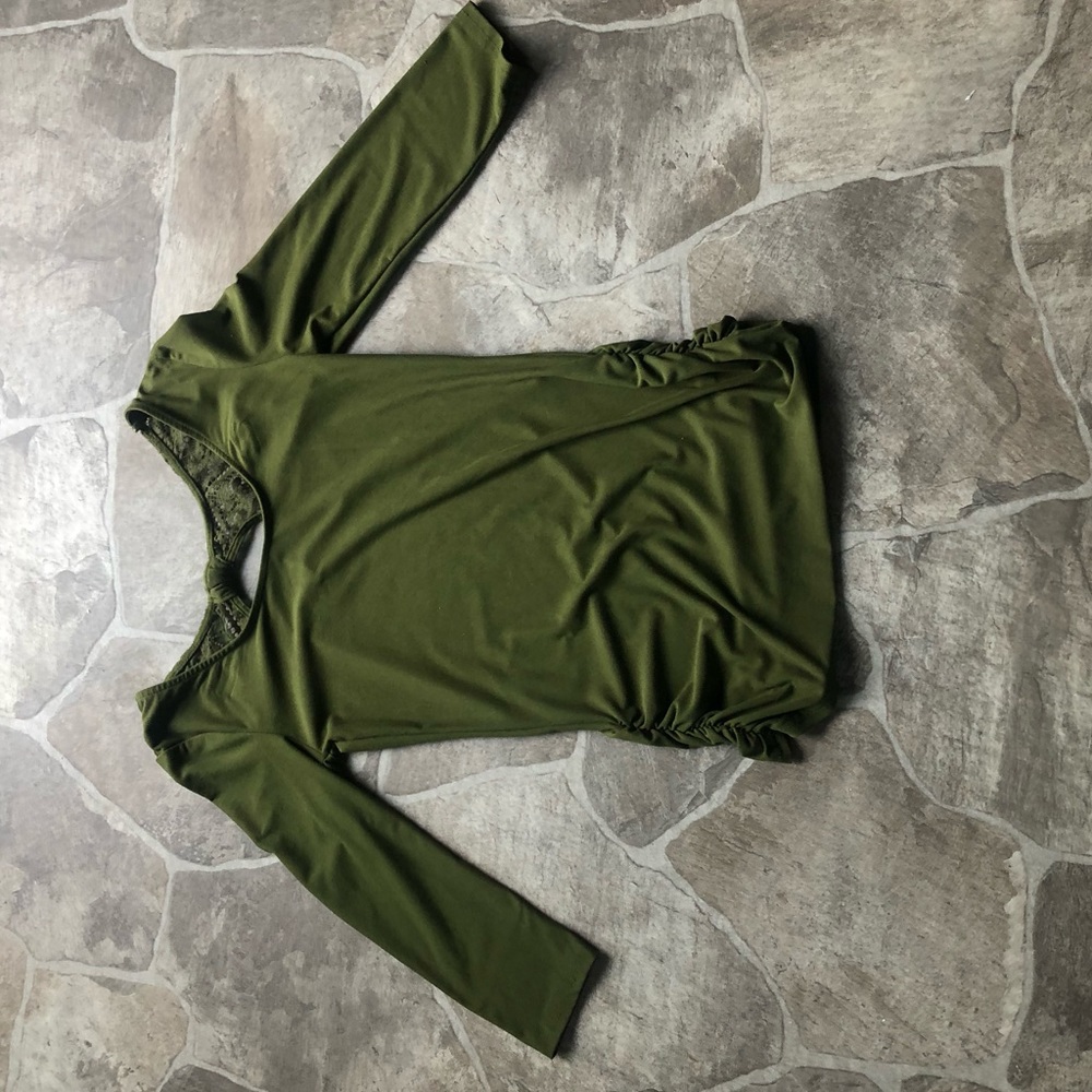A green No Boundaries shirt